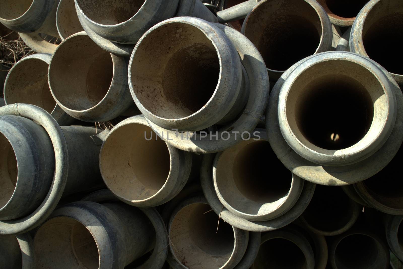 Irrigation pipes piled up in waiting summer time