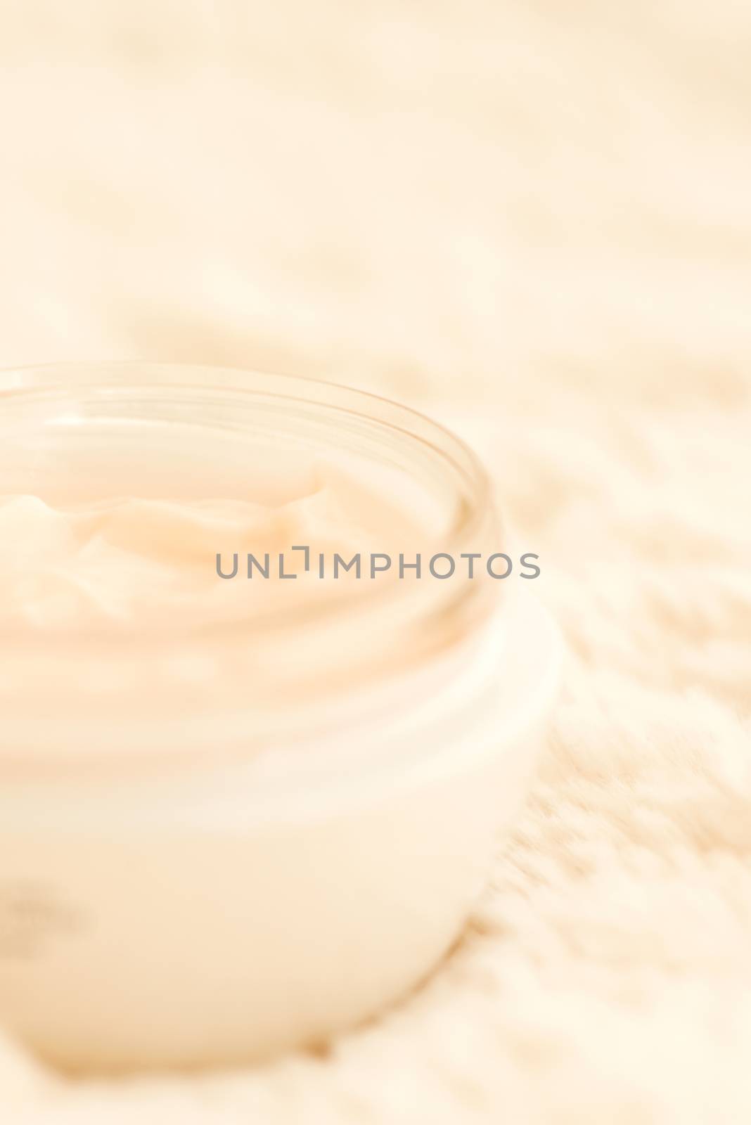 Cosmetic cream in jar close up shallow DOF by Nanisimova