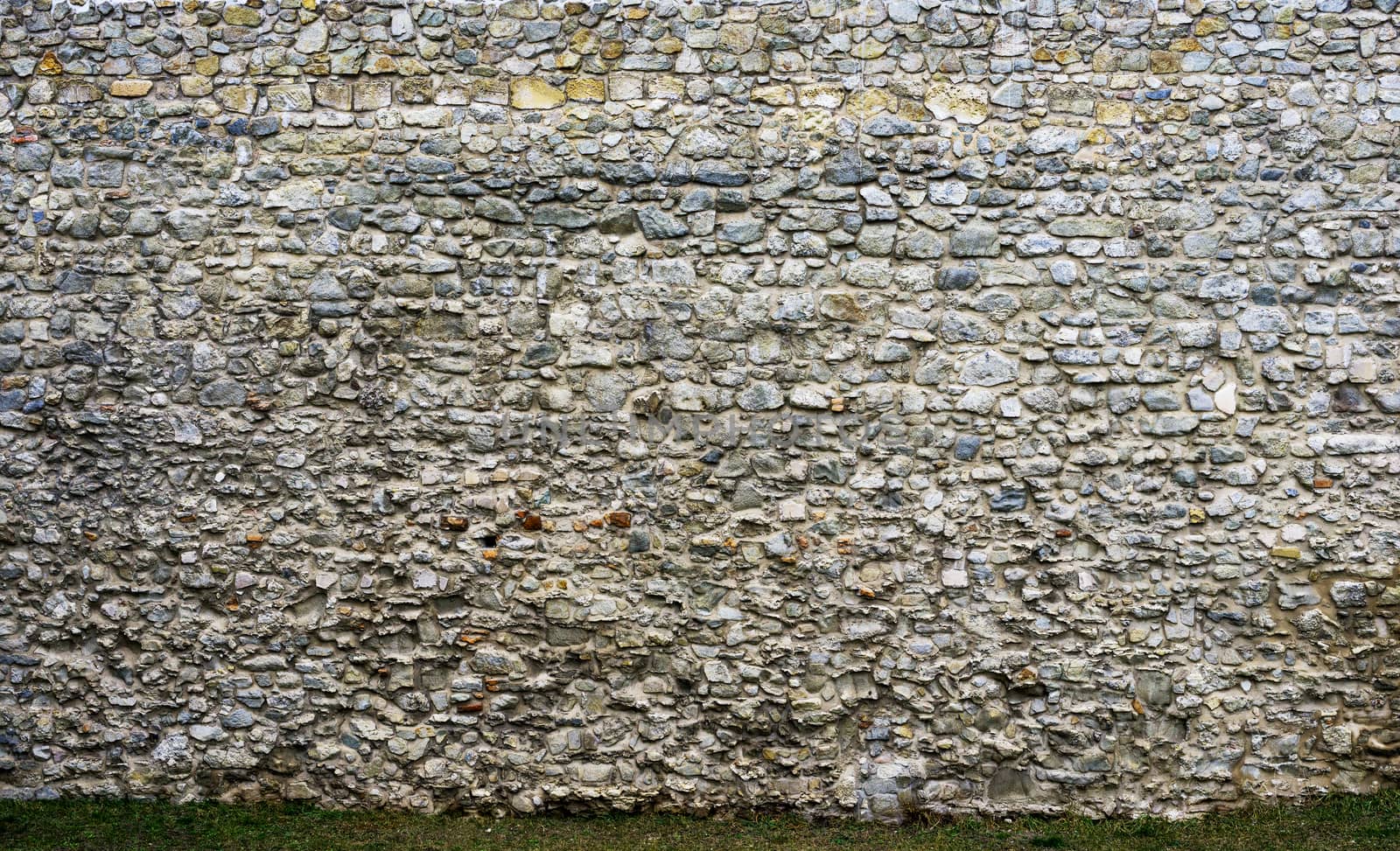 Ancient stone wall of the castle. texture of rough stone