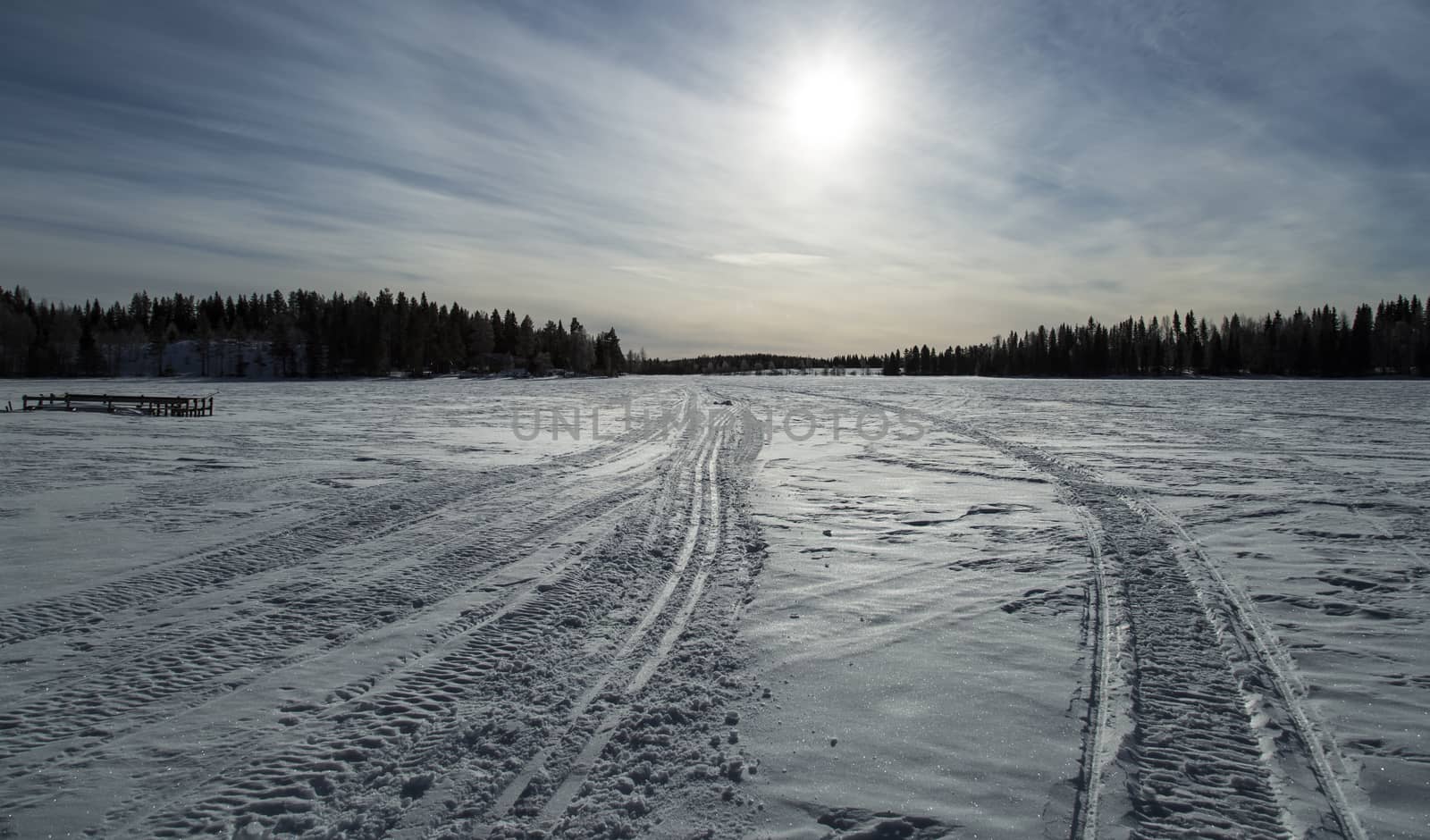 Tracks on Frozen Lake in Winter