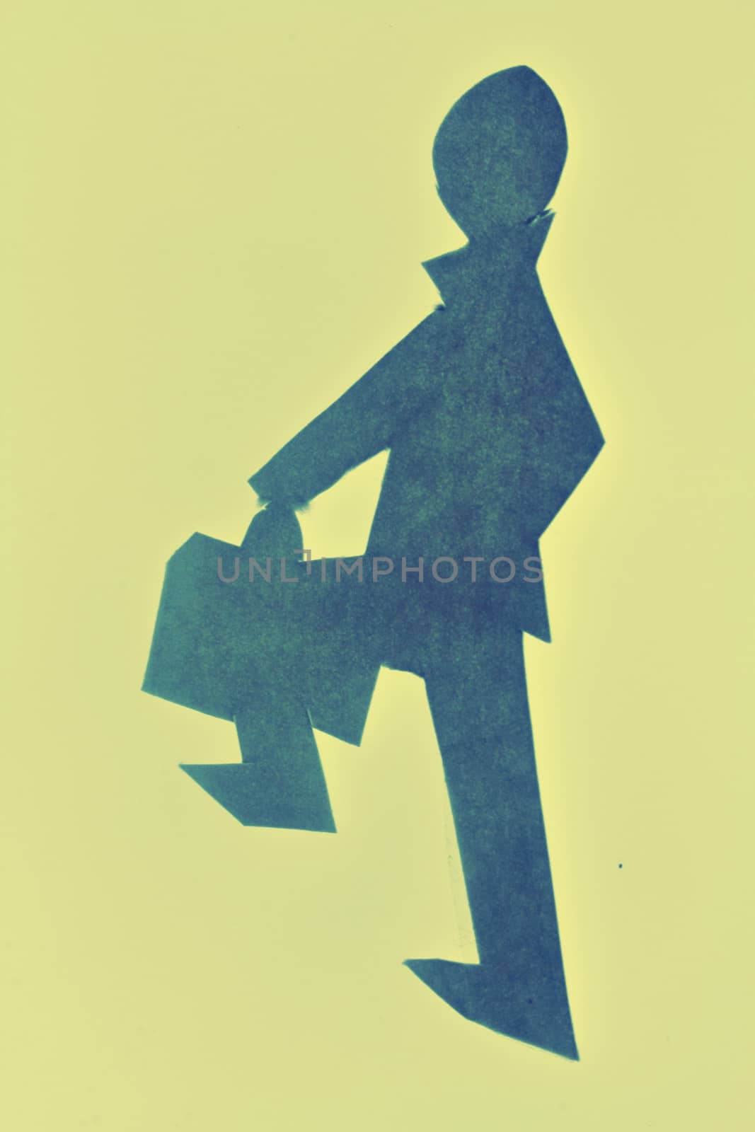 Businessman walking with a briefcase by yands