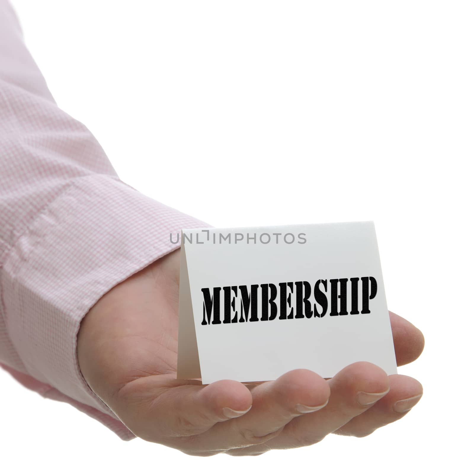 Business man holding membership sign on hand