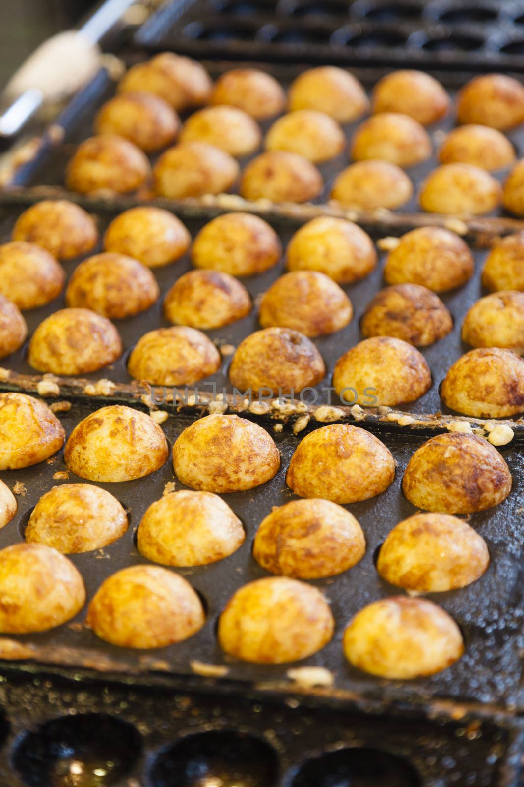 Takoyaki - Octopus ball, a popular Japanese street food by ymgerman