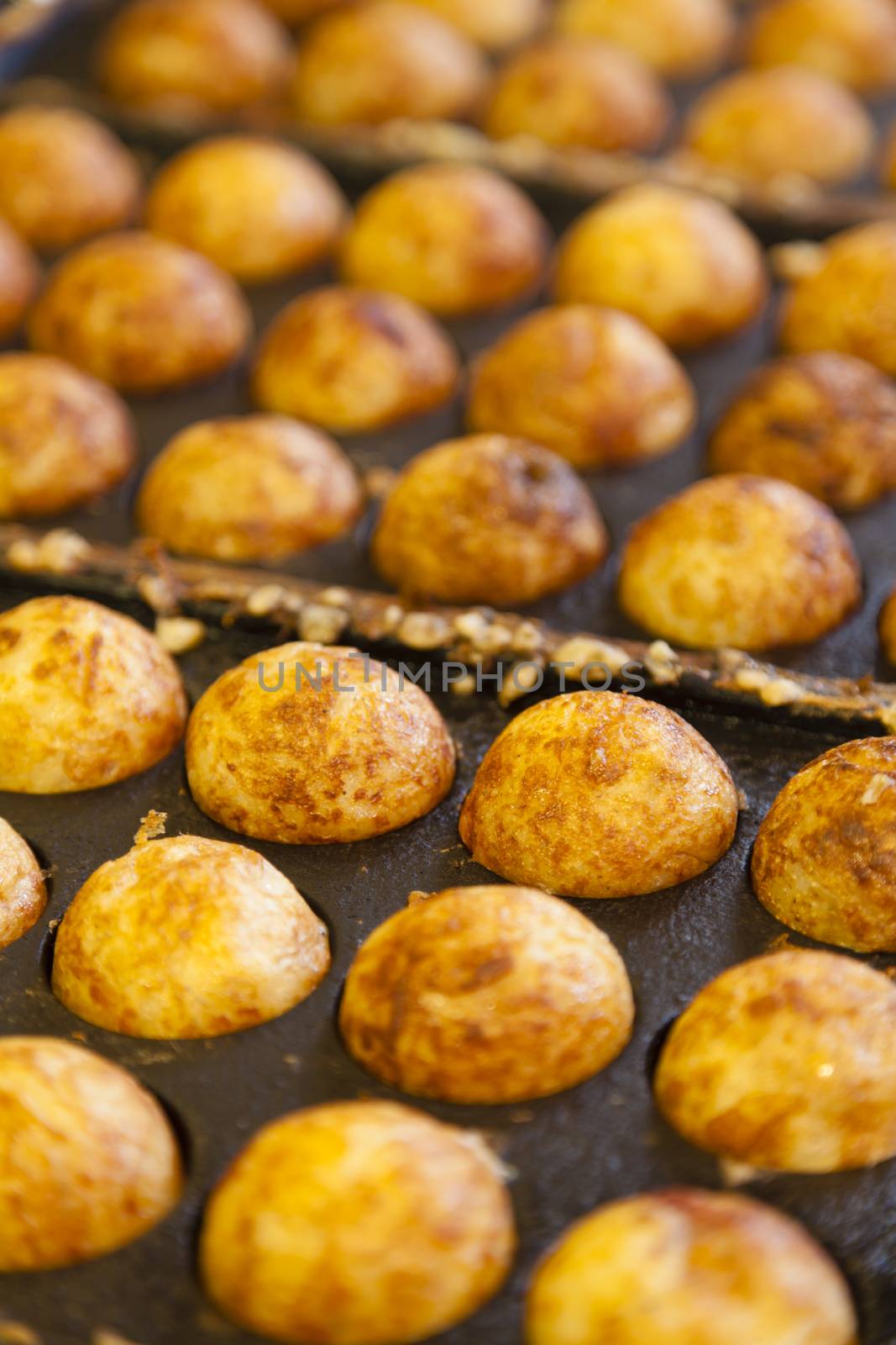 Takoyaki - Octopus ball, a popular Japanese street food by ymgerman