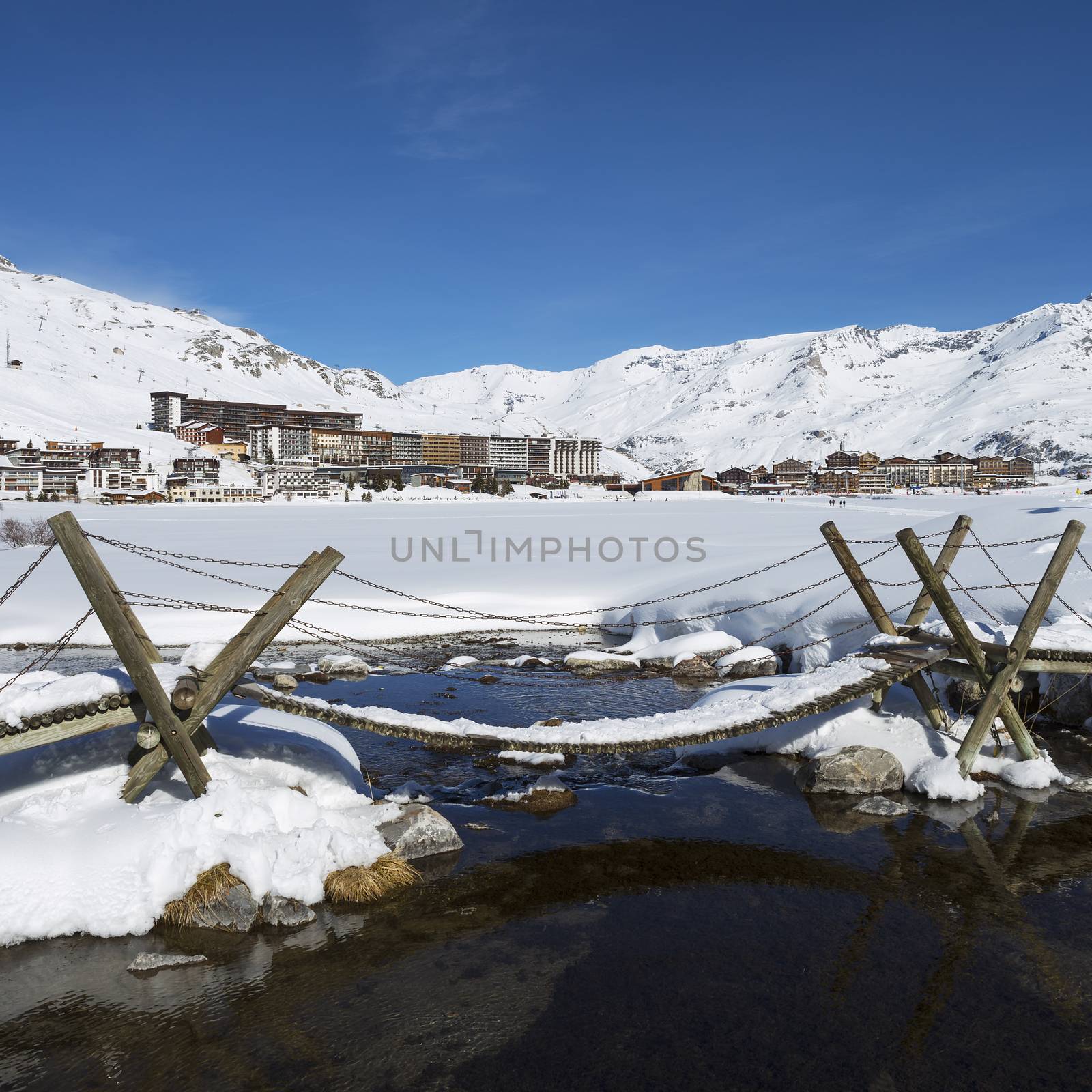 View of Tignes village with footbridge, France.