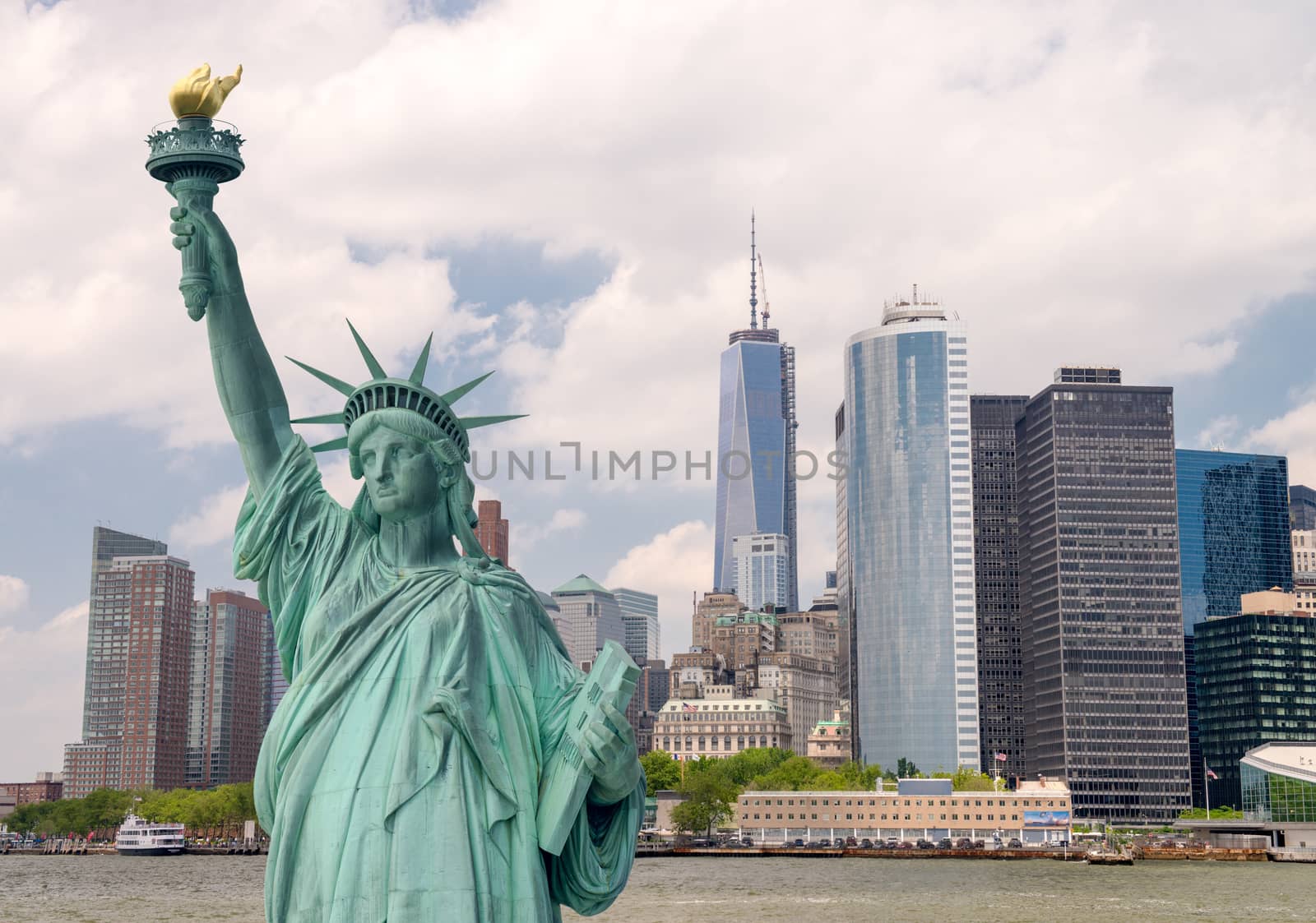 New York City tourism concept. Statue of Liberty with Lower Manhattan skyline.