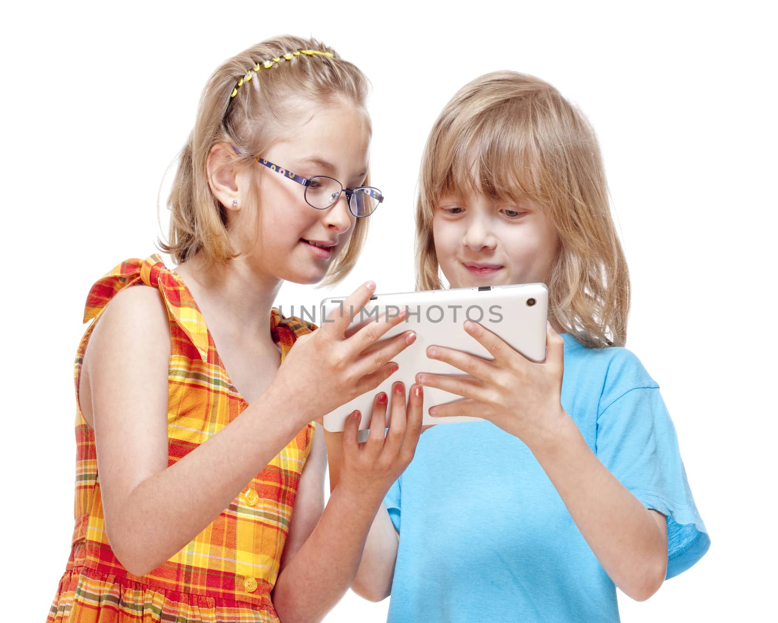 Two Children Having Fun with Digital Tablet - Isolated on White