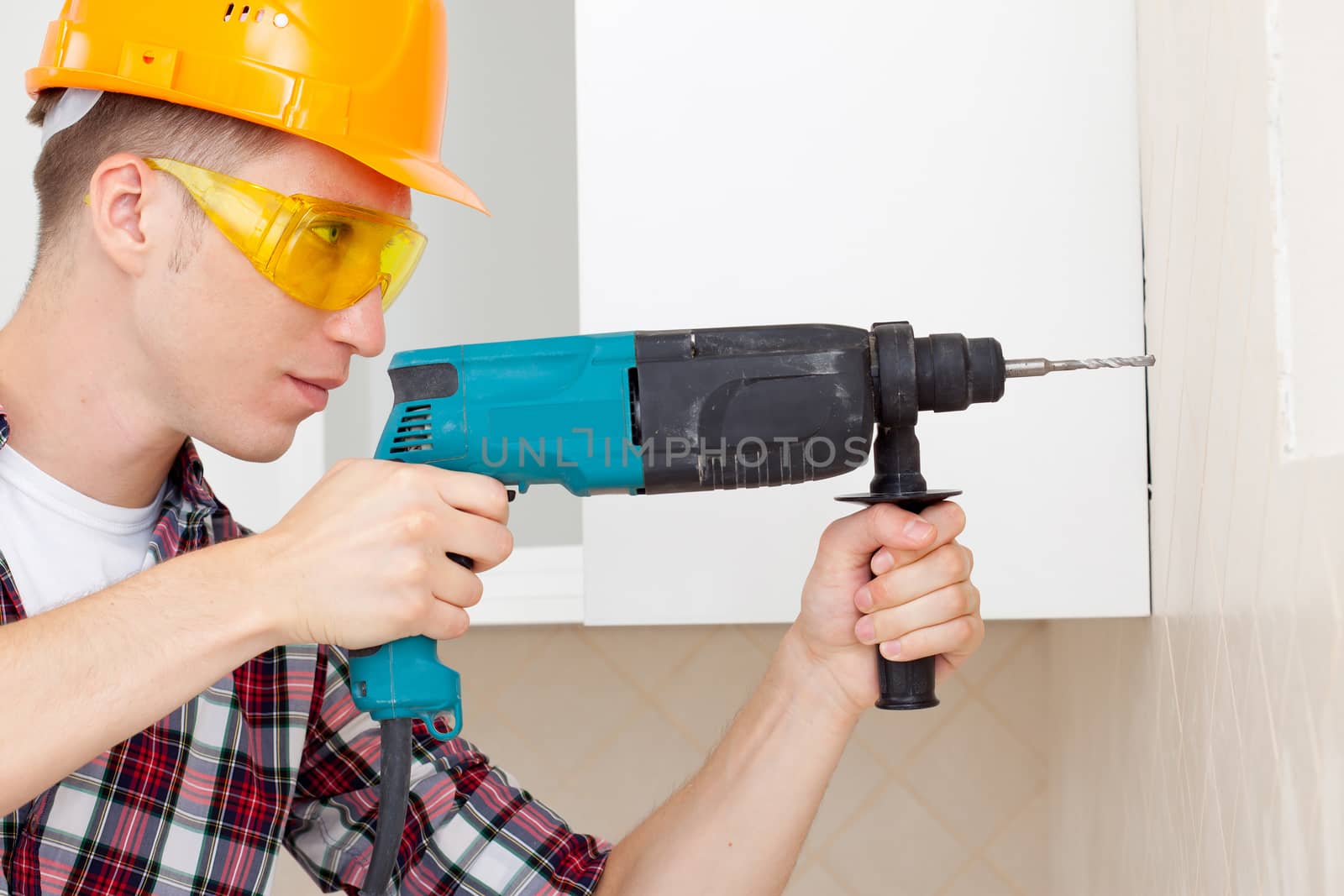 worker with drill by Astroid