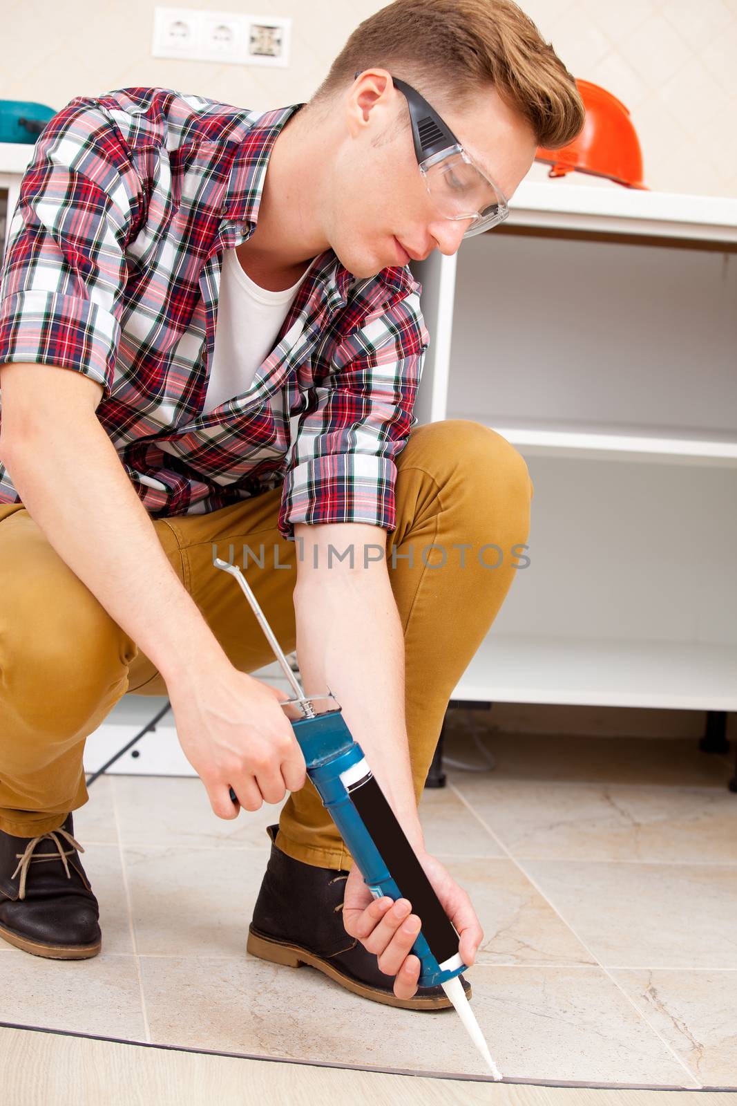 worker repairing the floor by Astroid