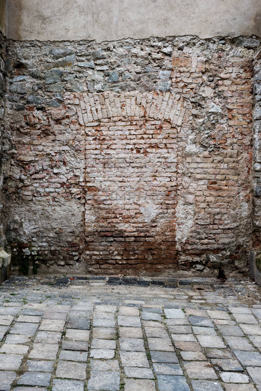 Bricked up doorway in a stone wall