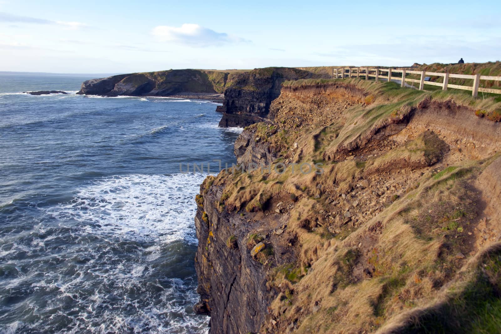 the fenced path along the cliff edge by morrbyte