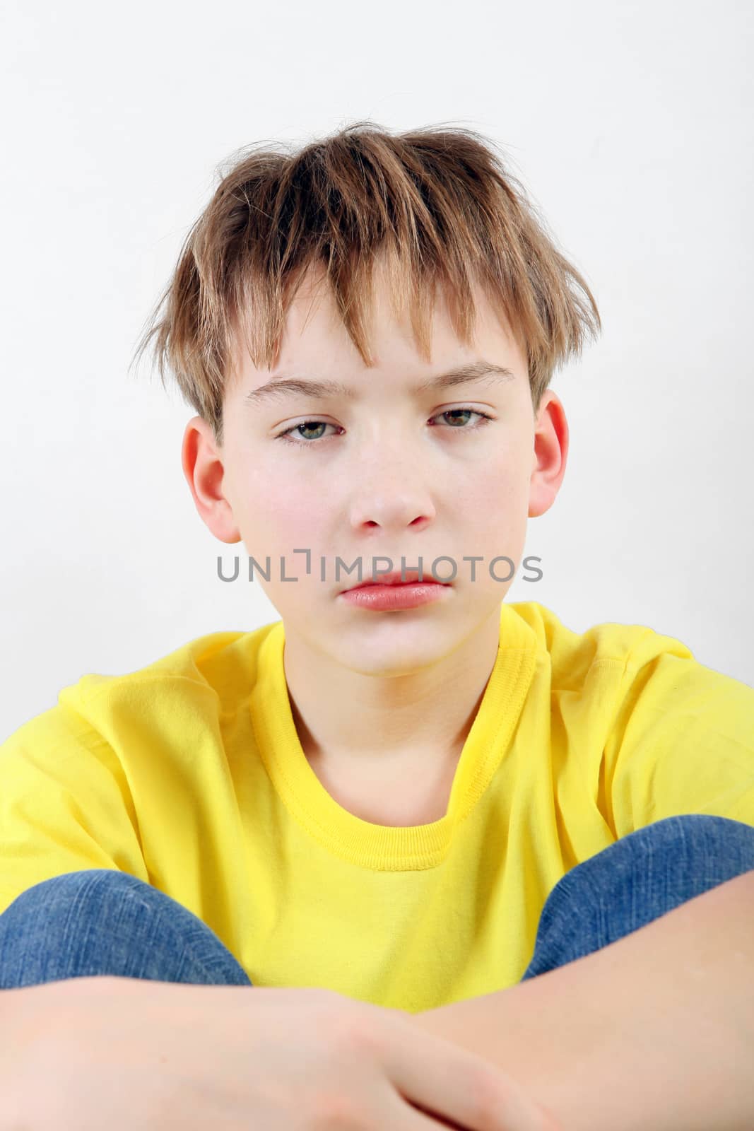 Sad and Tired Teenager on the White Background