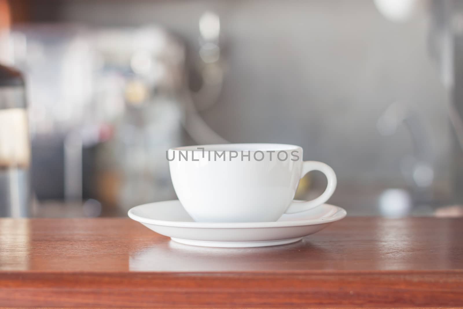 White coffee cup in coffee shop, stock photo