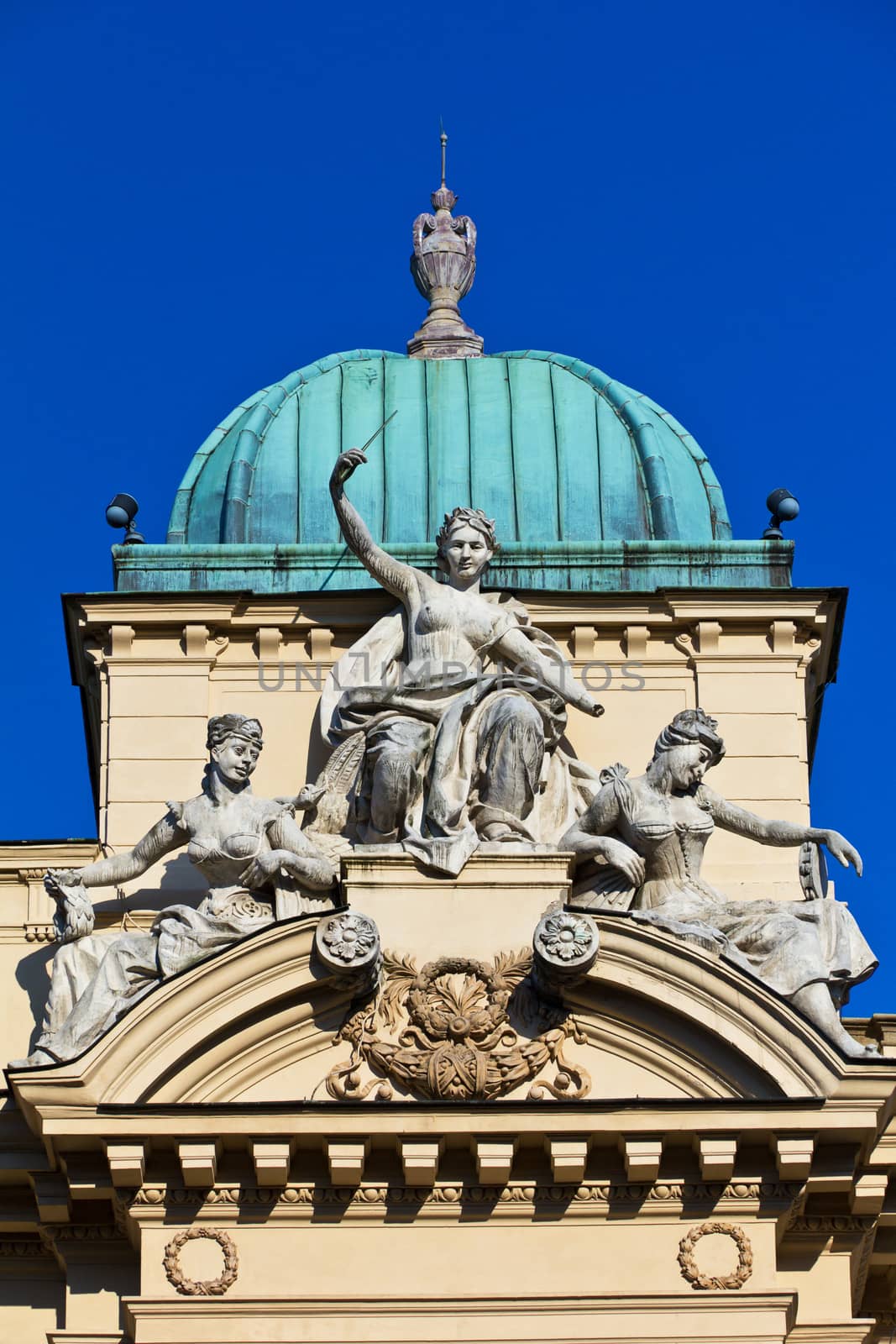 sculpture of three women on facade of juliusz slowacki theater in cracow in poland