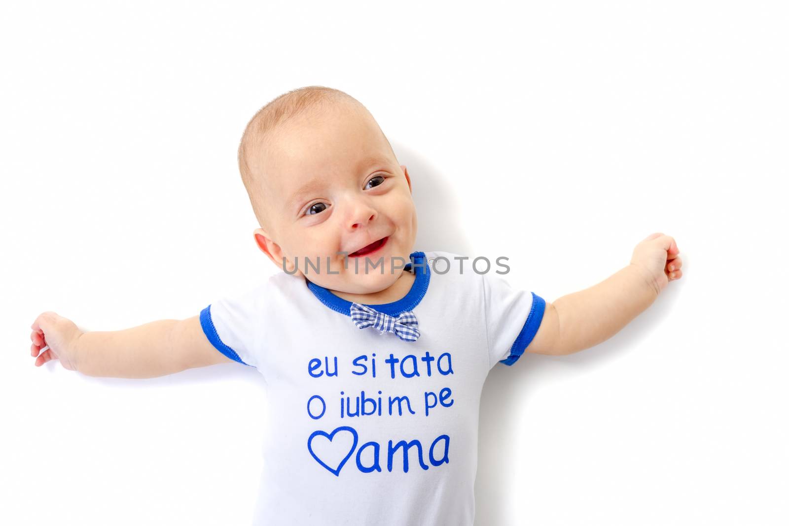 baby boy lying on white floor