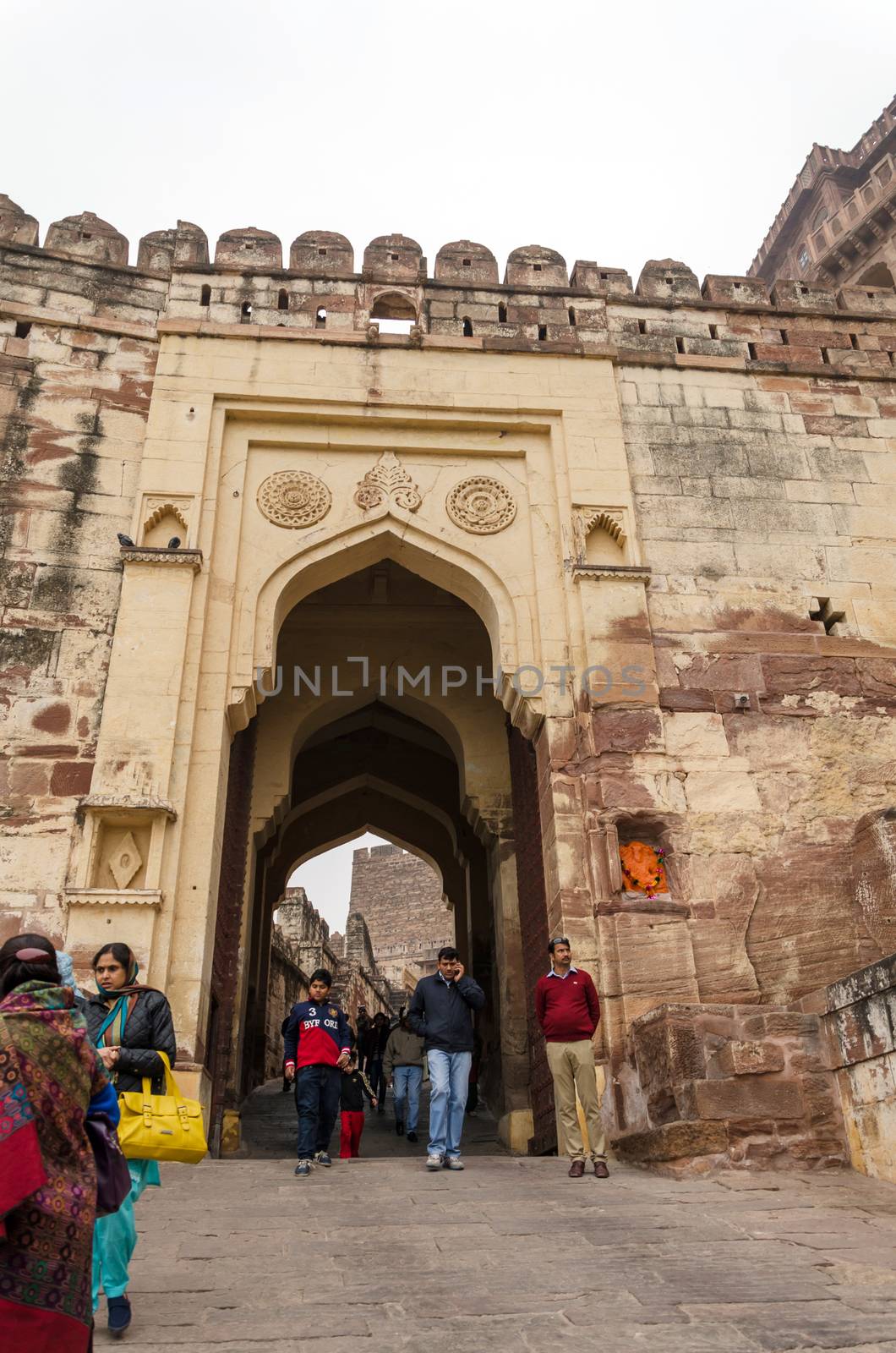Jodhpur, India - January 1, 2015: Unidentified people walk through a gate at Mehrangarh Fort on January 1, 2015 in Jodhpur, India. City is popular tourist destination in Rajasthan