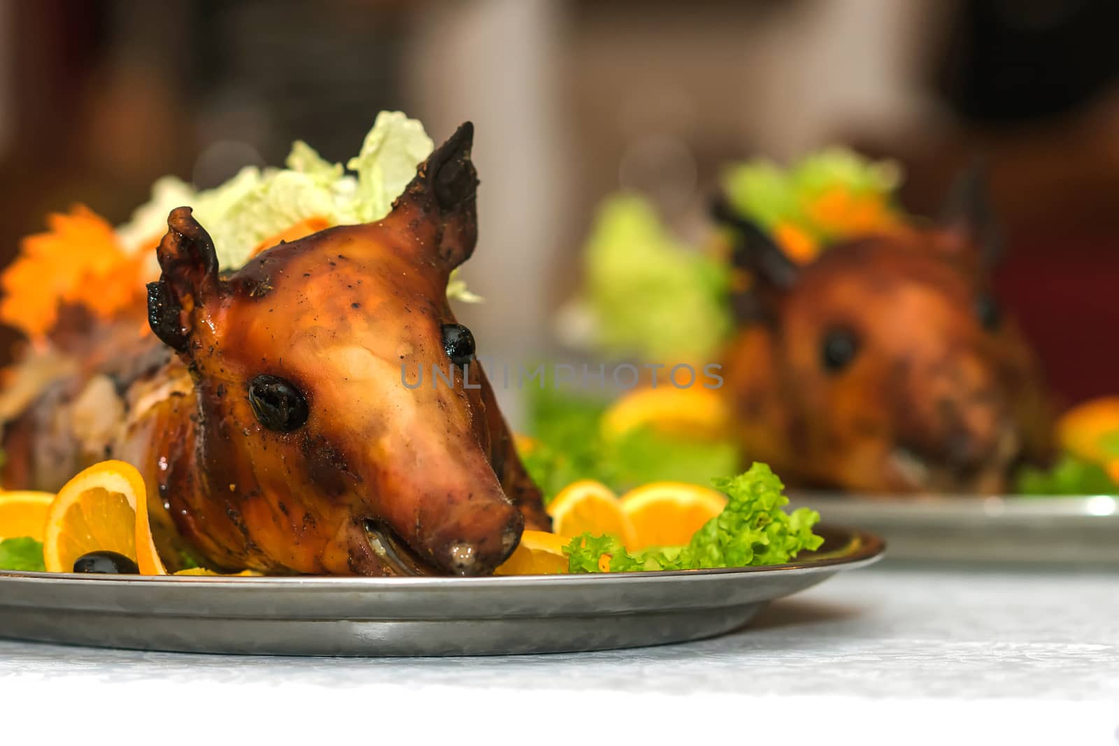 Roasted pig on a plate in a restaurant 