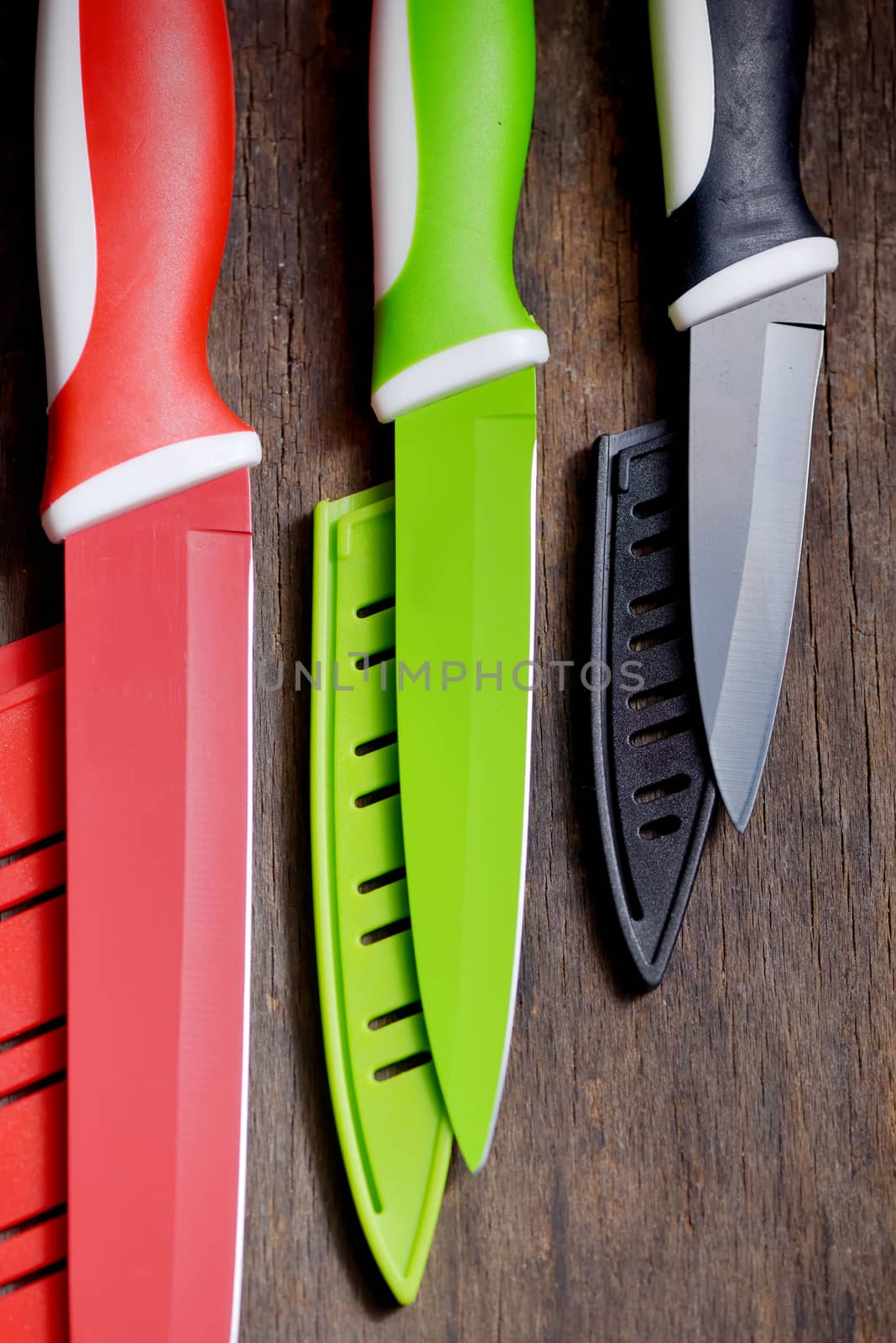 ceramic knifes on old wooden table