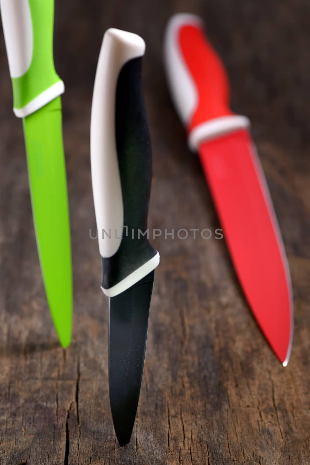 ceramic knifes on old wooden table
