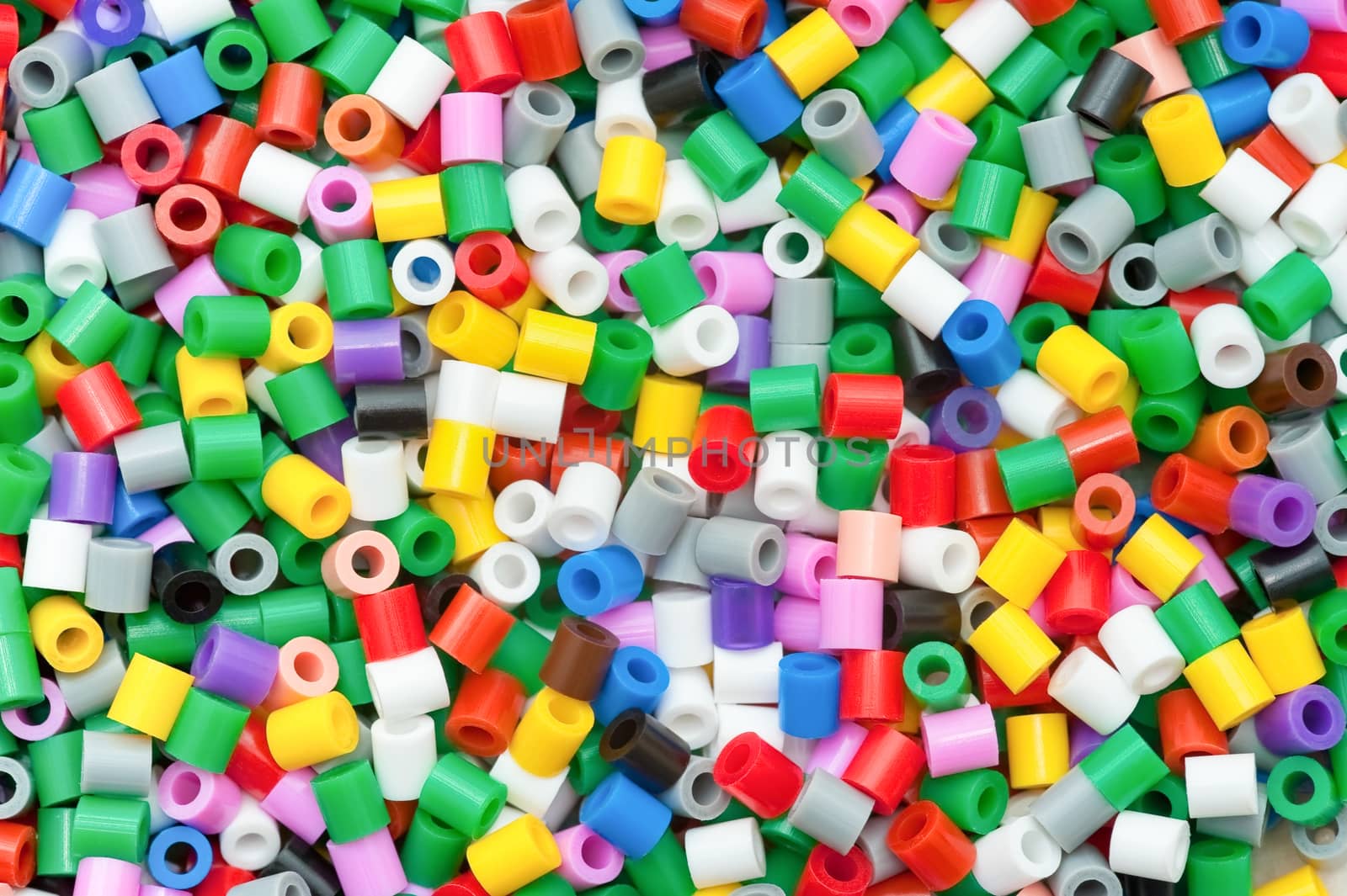 background of multicolored decorative plastic craft beads