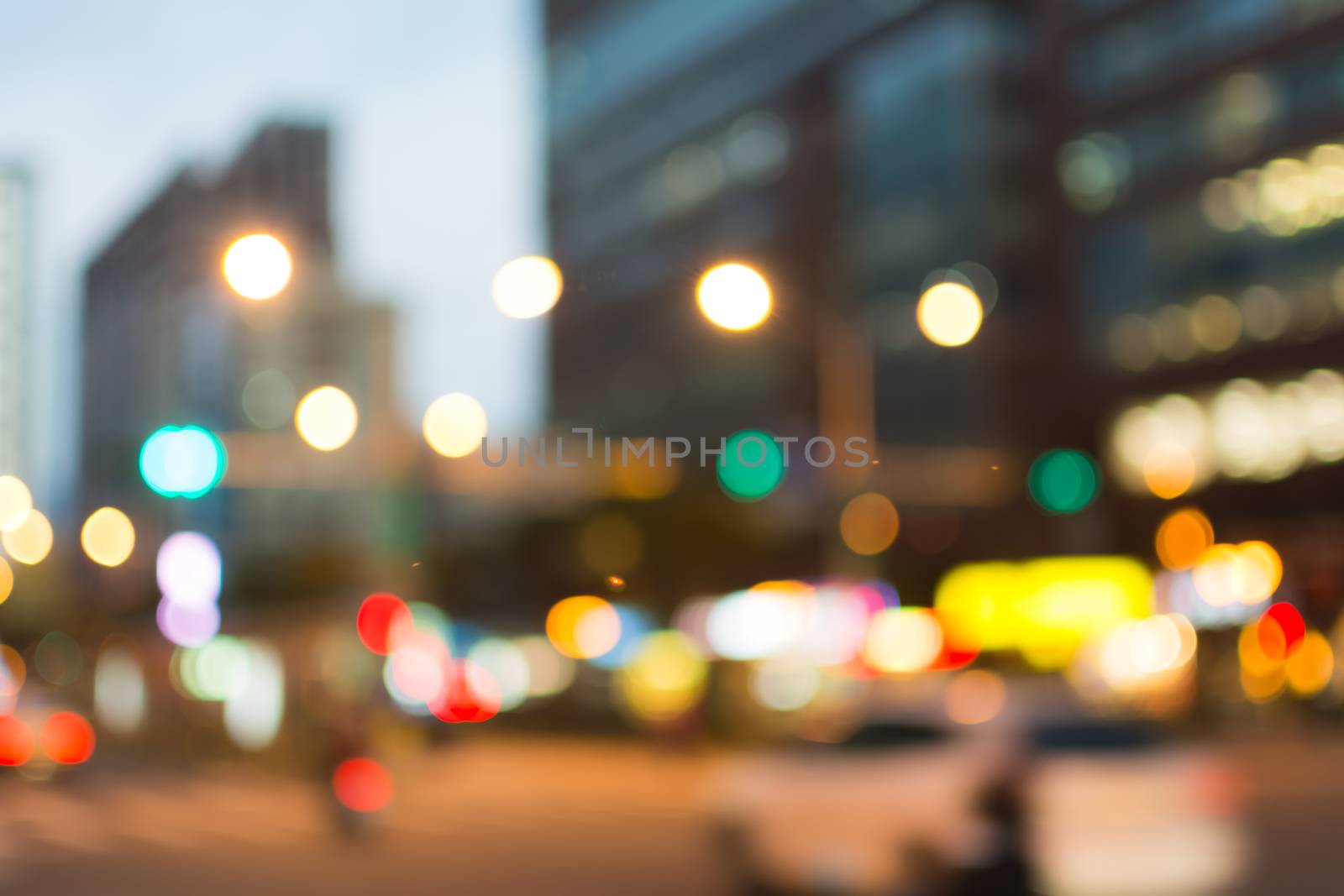 Abstract urban background with blurred buildings and street, shallow depth of focus.