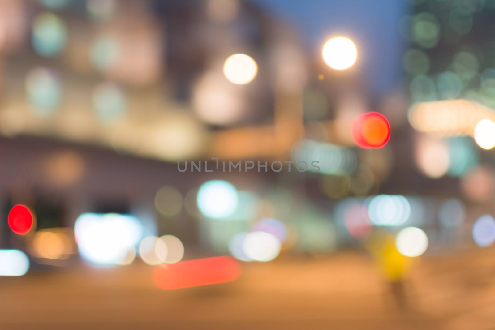 Abstract urban background with blurred buildings and street, shallow depth of focus.