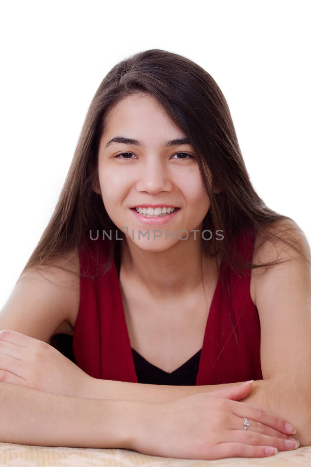 Beautiful biracial teen girl in red dress sitting arms crossed,  by jarenwicklund