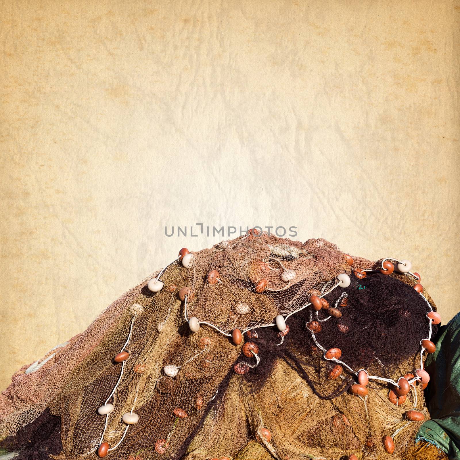 Fishing net with ropes and floats on a old brown paper