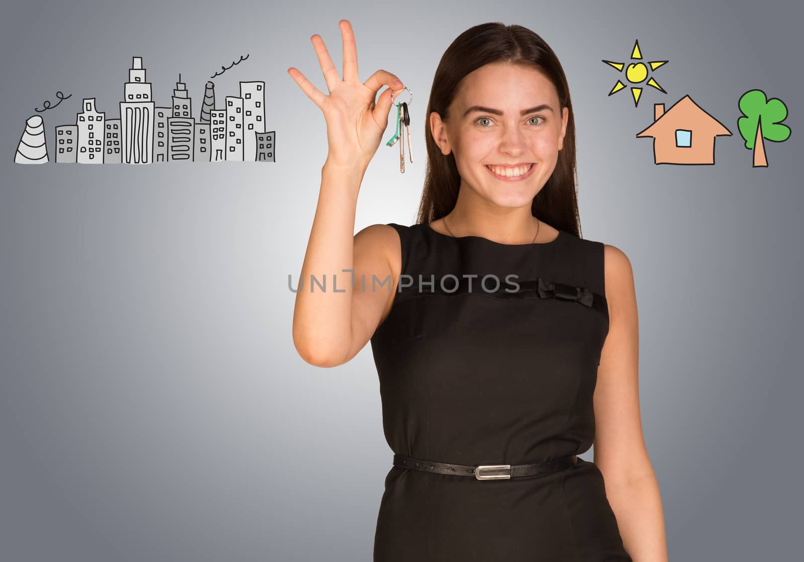 Woman holding keys in her hand and making choice between city and country, looking at camera, on gray background