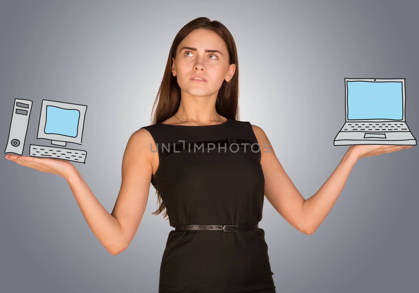 Woman making choice between desktop computer and laptop by cherezoff