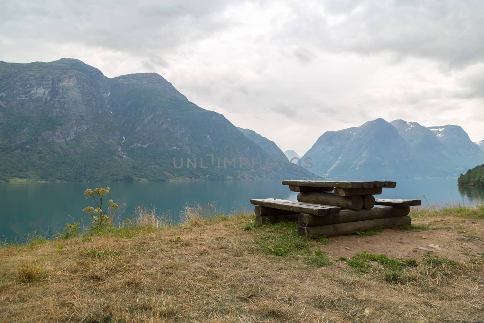 Wooden bench in a norwegian fjord