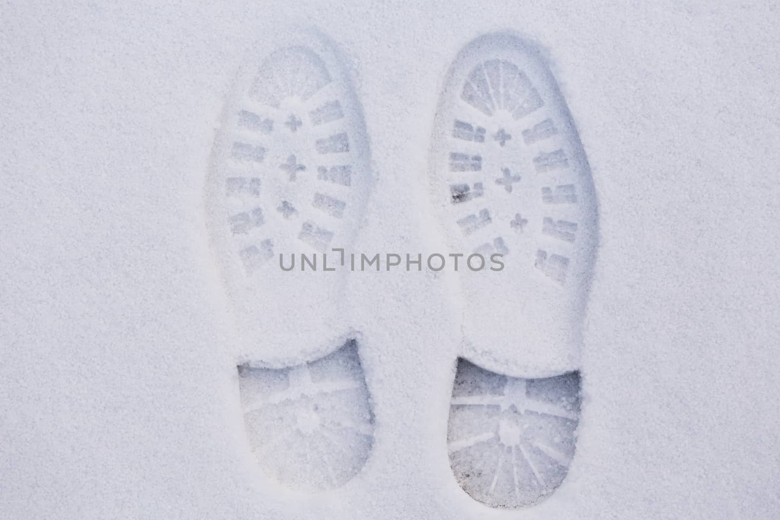 Picture of a pair of footprints in white snow