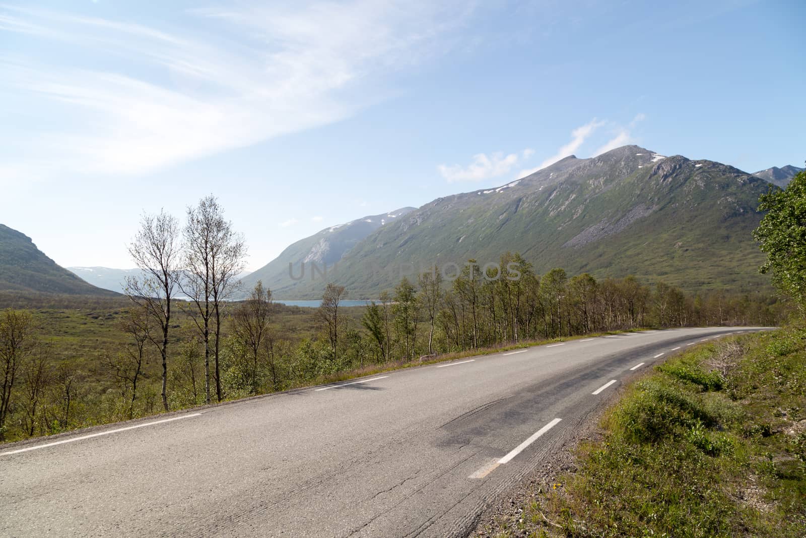 Road with mountains by Stootsy