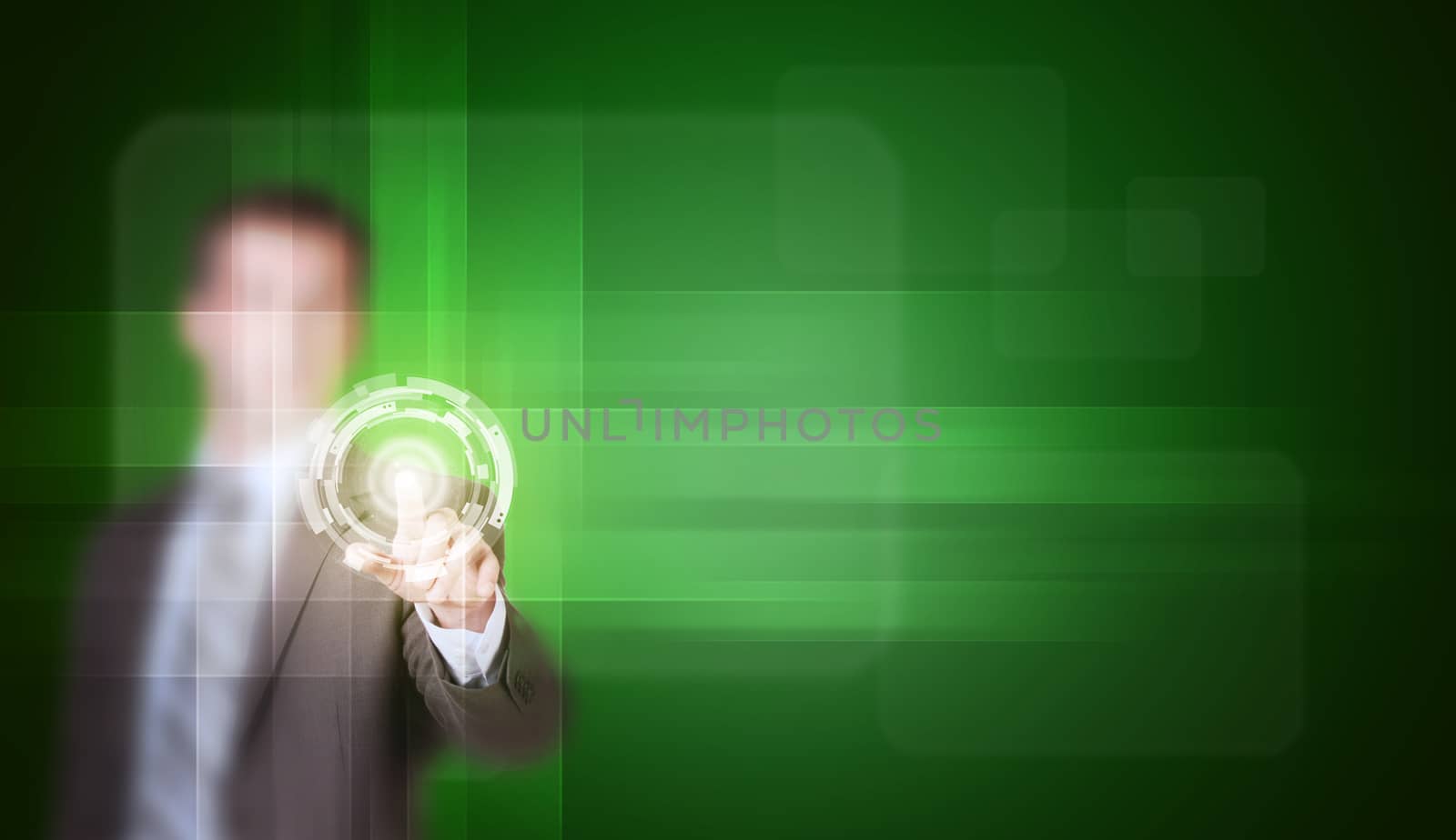 Businessman in suit finger presses virtual button. Green gradient background