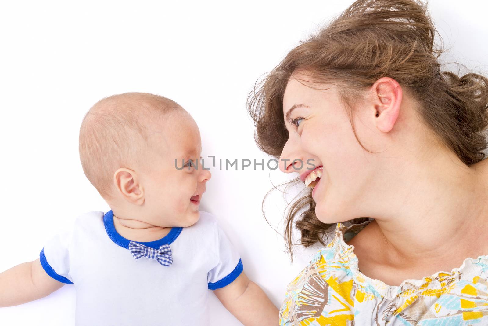 mother talks with her baby boy on withe background