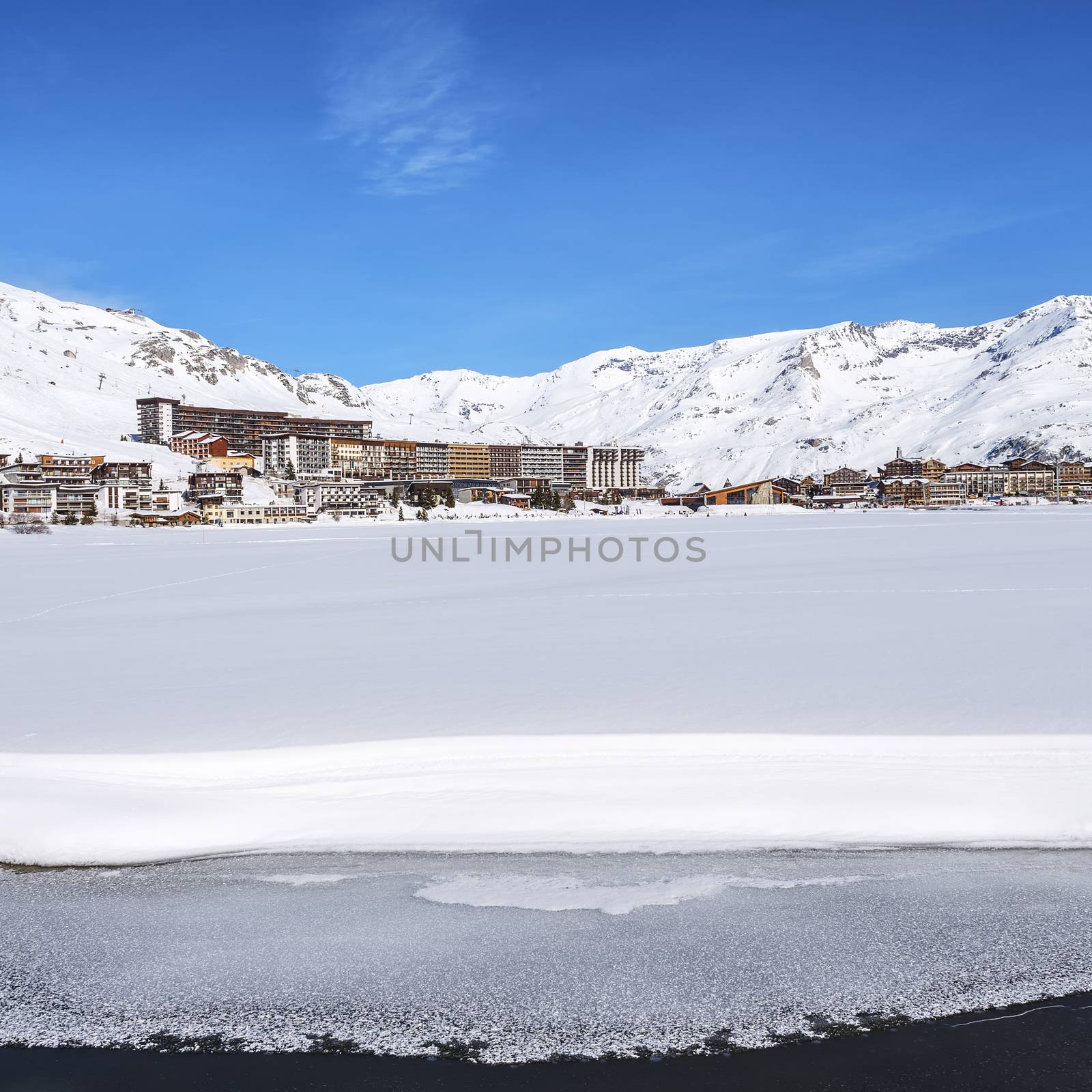 View of Tignes village and lake in winter, France.