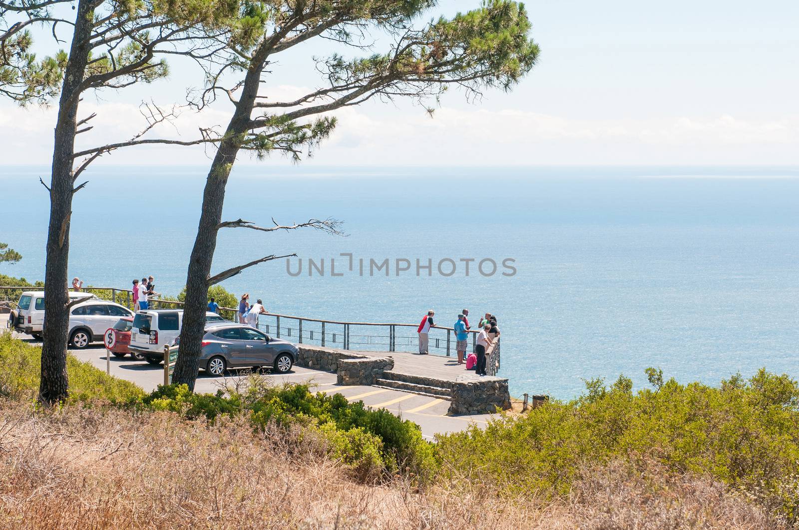 CAPE TOWN, SOUTH AFRICA - DECEMBER 18TH, 2014: Unidentified people at the viewpoint on Signal Hill. It offers a magnificent view of the city, Robben Island, Table Mountain, Lions Head and Devils Peak
