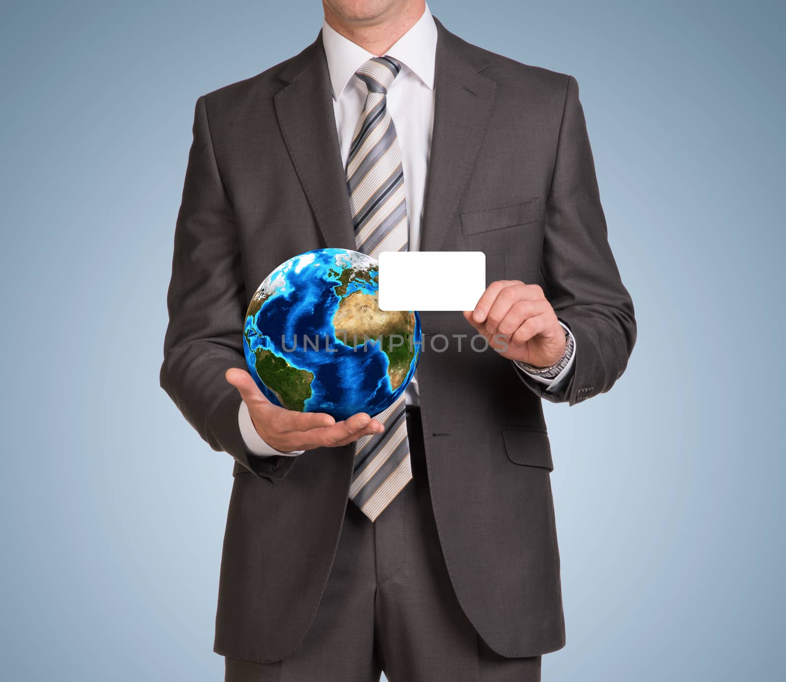 Businessman in suit hold empty card and Earth. Elements of this image are furnished by NASA