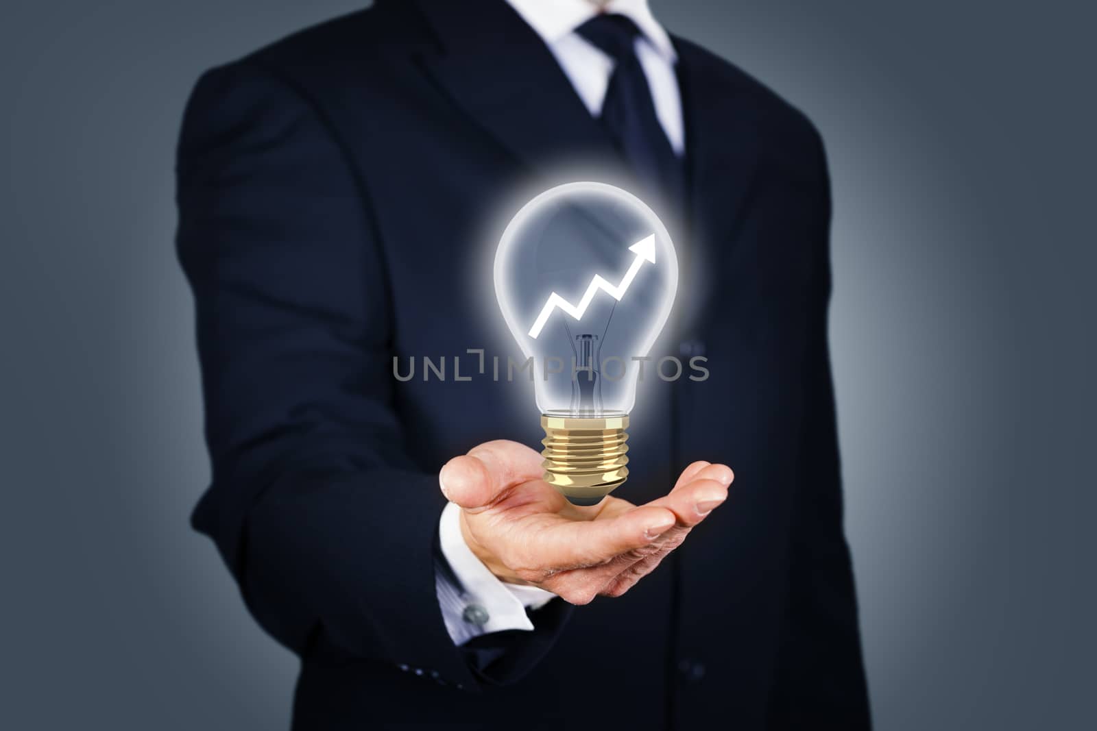 Businessman with a light bulb with rising chart