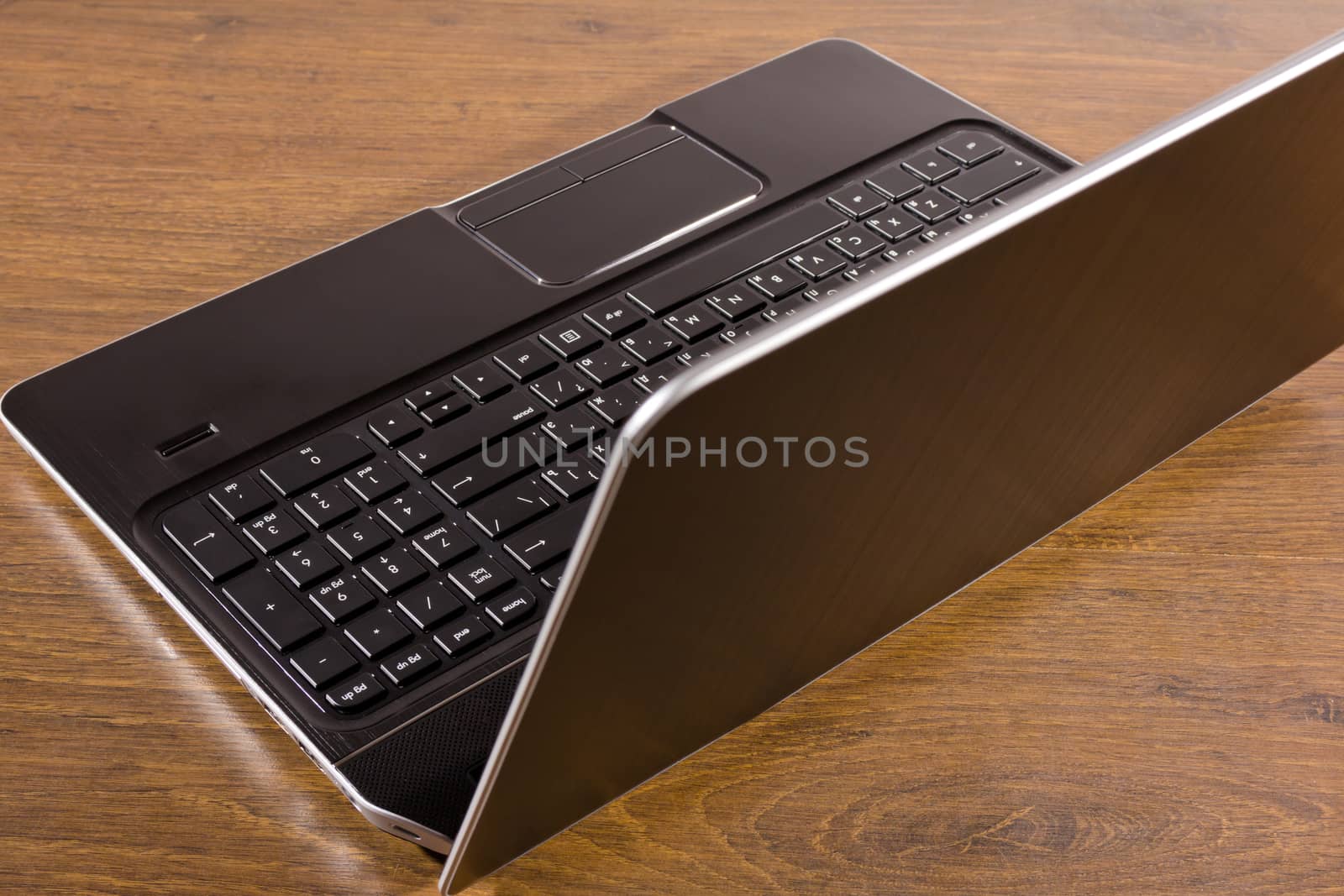 new open laptop on wooden background
