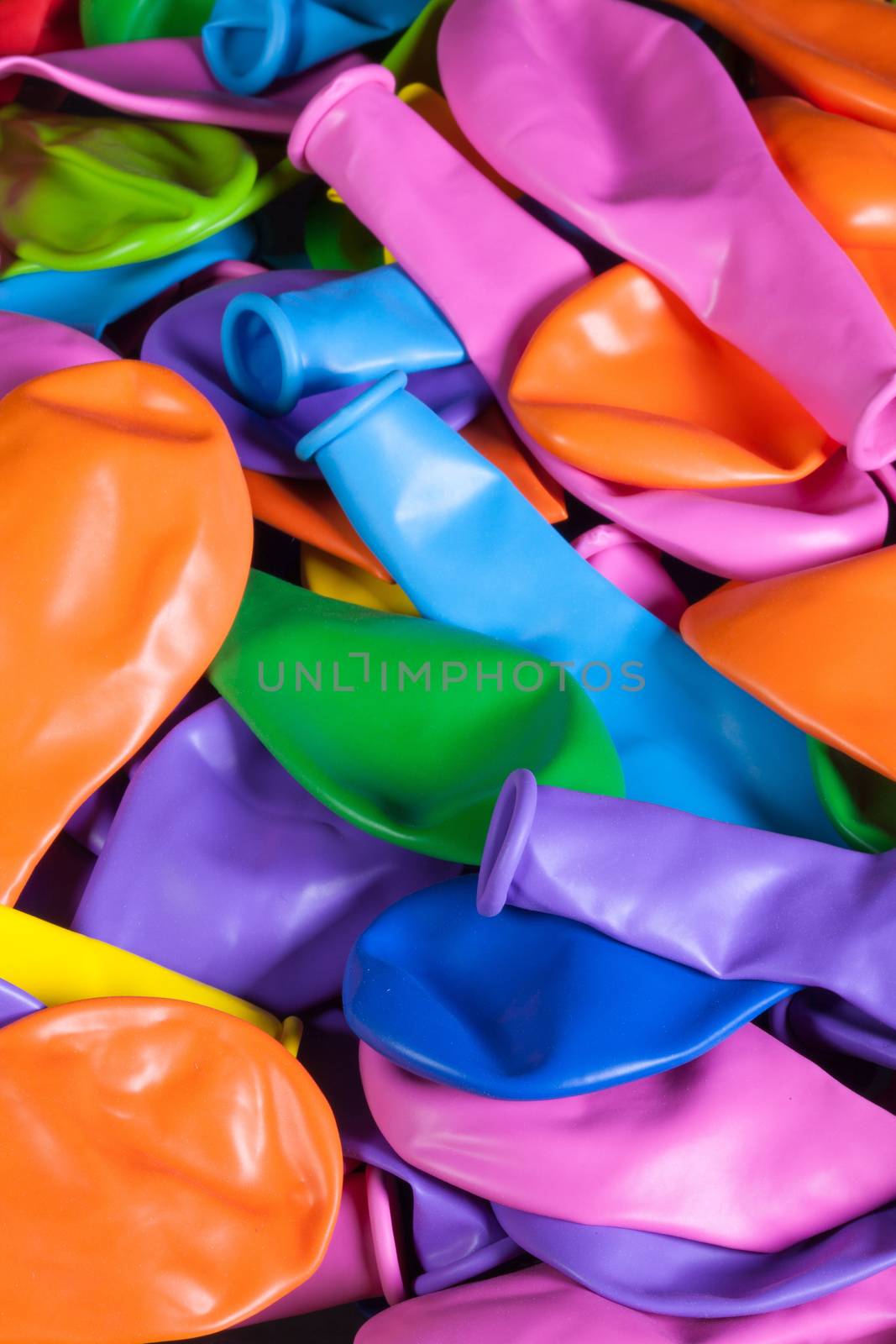 Colorful deflated balloons on the table