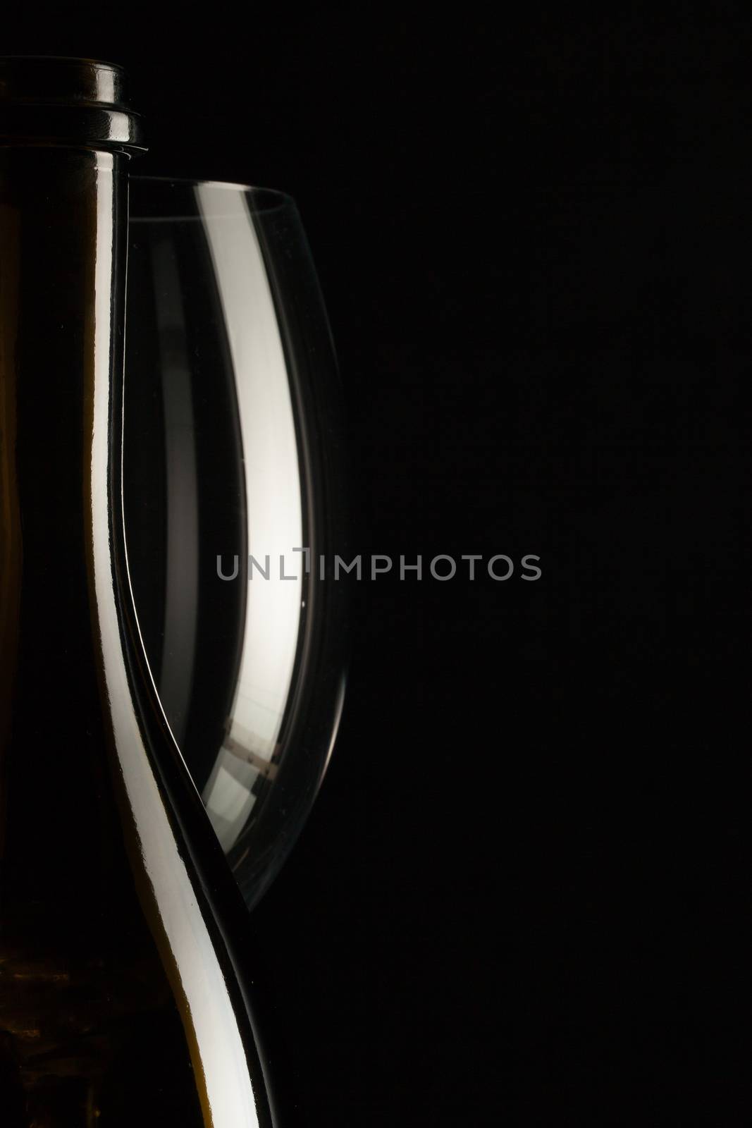 Silhouettes of elegant wine glasses and a wine bottles  by CaptureLight