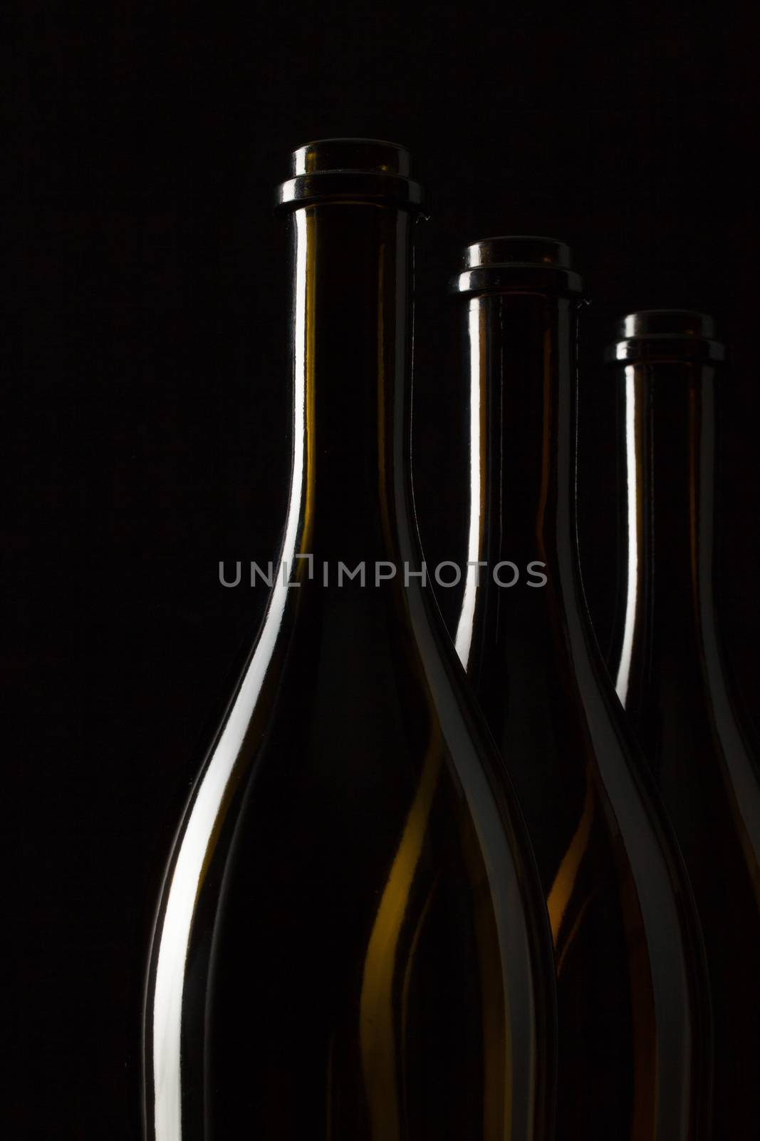 Silhouettes of elegant wine bottles by CaptureLight
