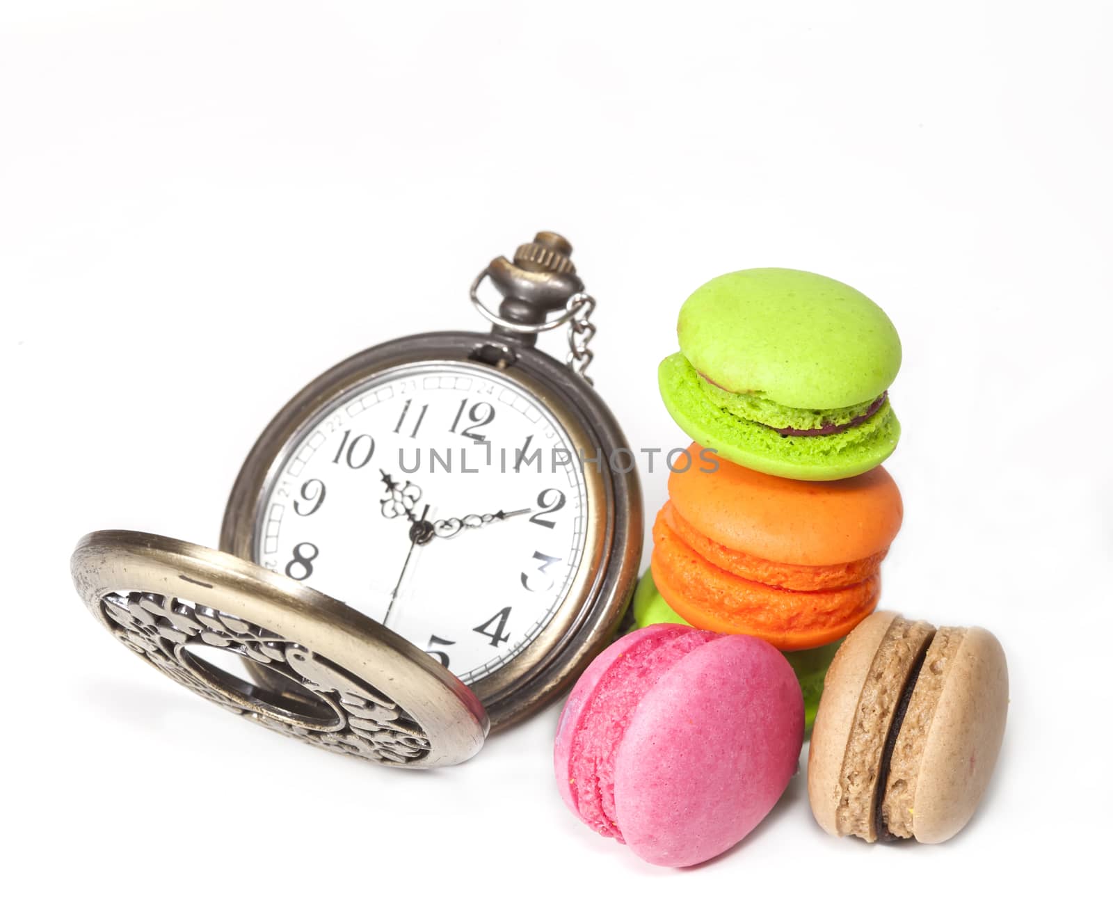 France dessert  macaroons and vintage clock on white background 
,isolate
