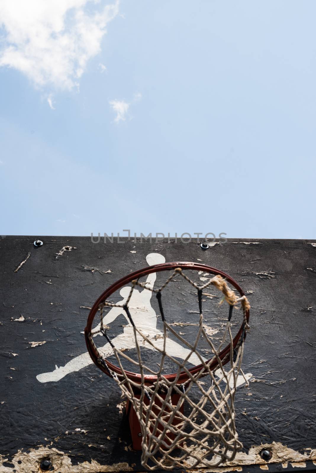KYIV, UKRAINE -  JUNE 17, 2014: Jumpman logo by Nike painted on the black backboard of the old basketball court in Kyiv.