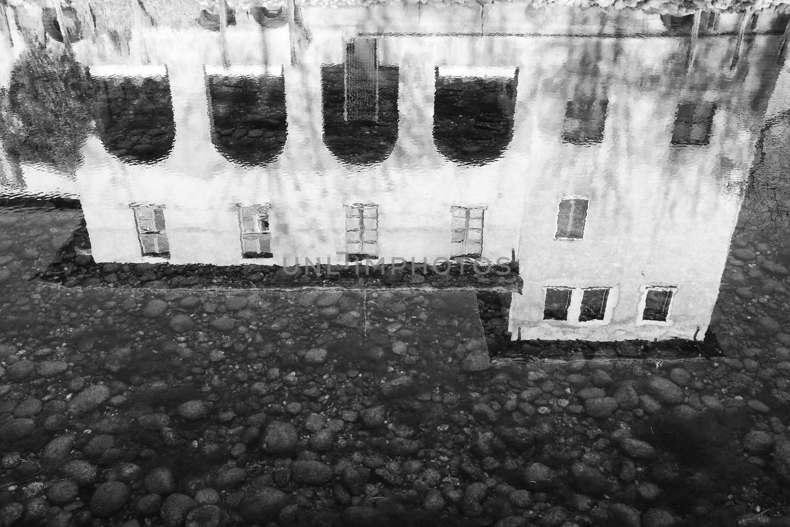 Black and White image of house reflection in water