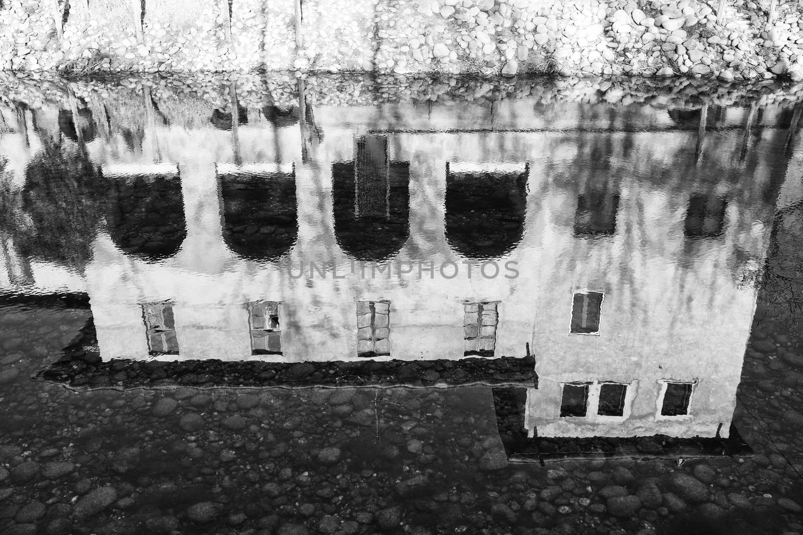 Black and White image of house reflection in water