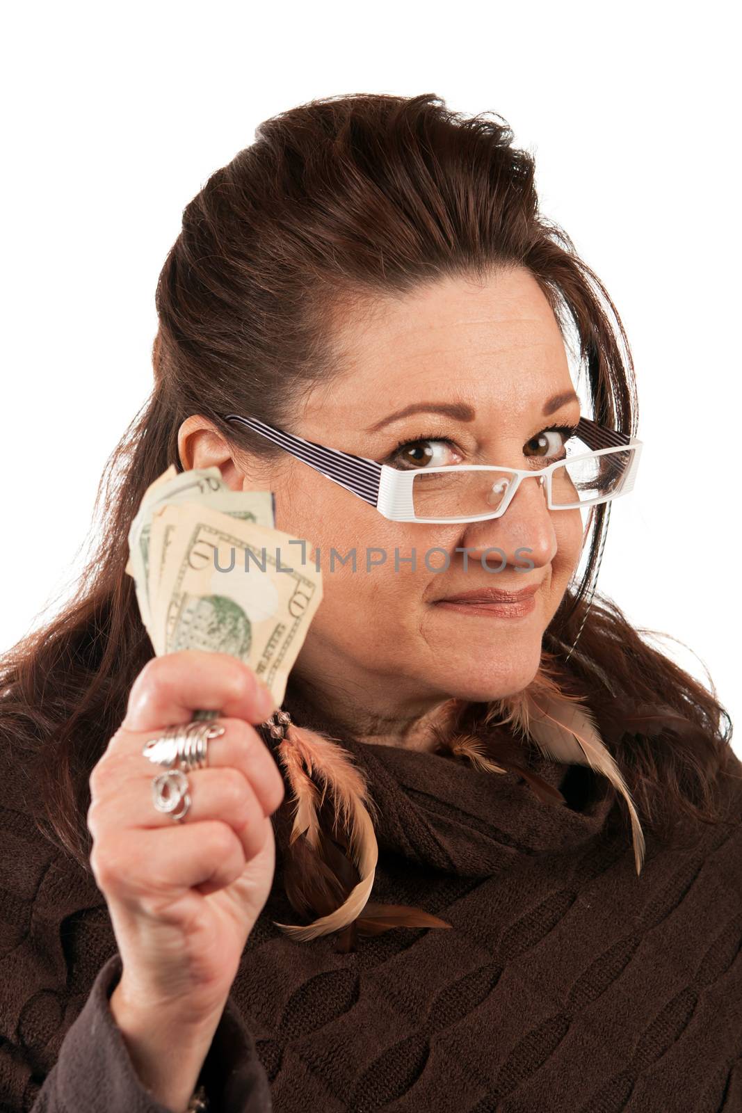 Brunette woman holding up some money in her hand.