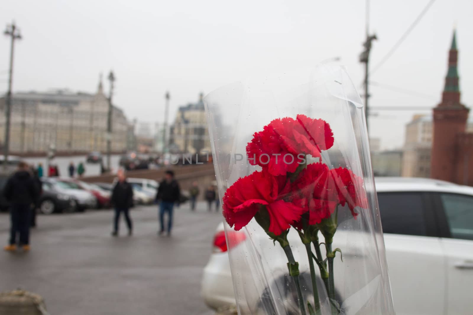 Moscow, Russia - February 28, 2015. People bring flowers to the site of the murder of politician Boris Nemtsov