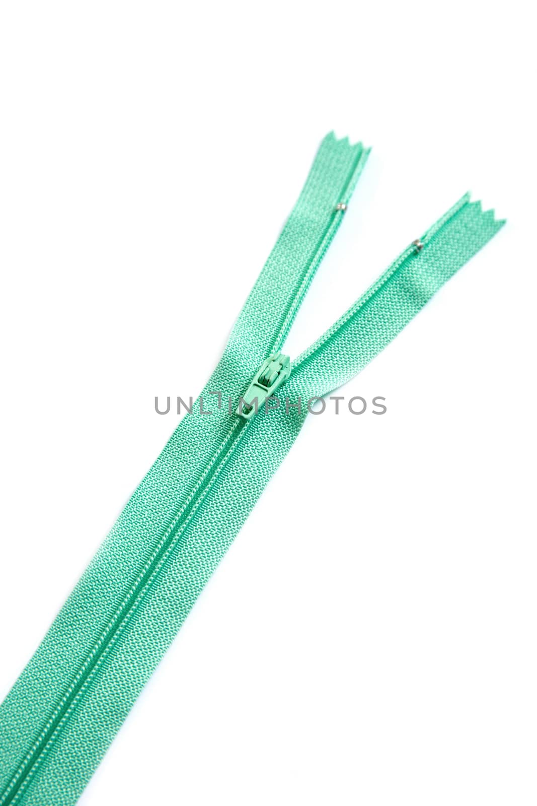 Green clothing zipper isolated on white background